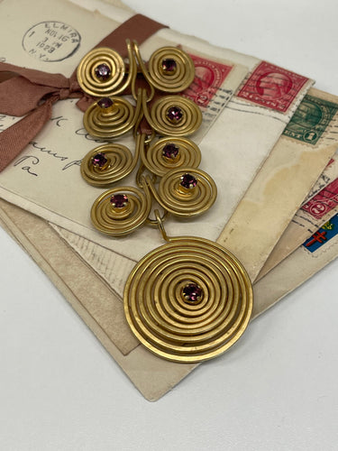 1970’s Matte Gold Spiral Brooch with Purple Rhinestones Devil's Details